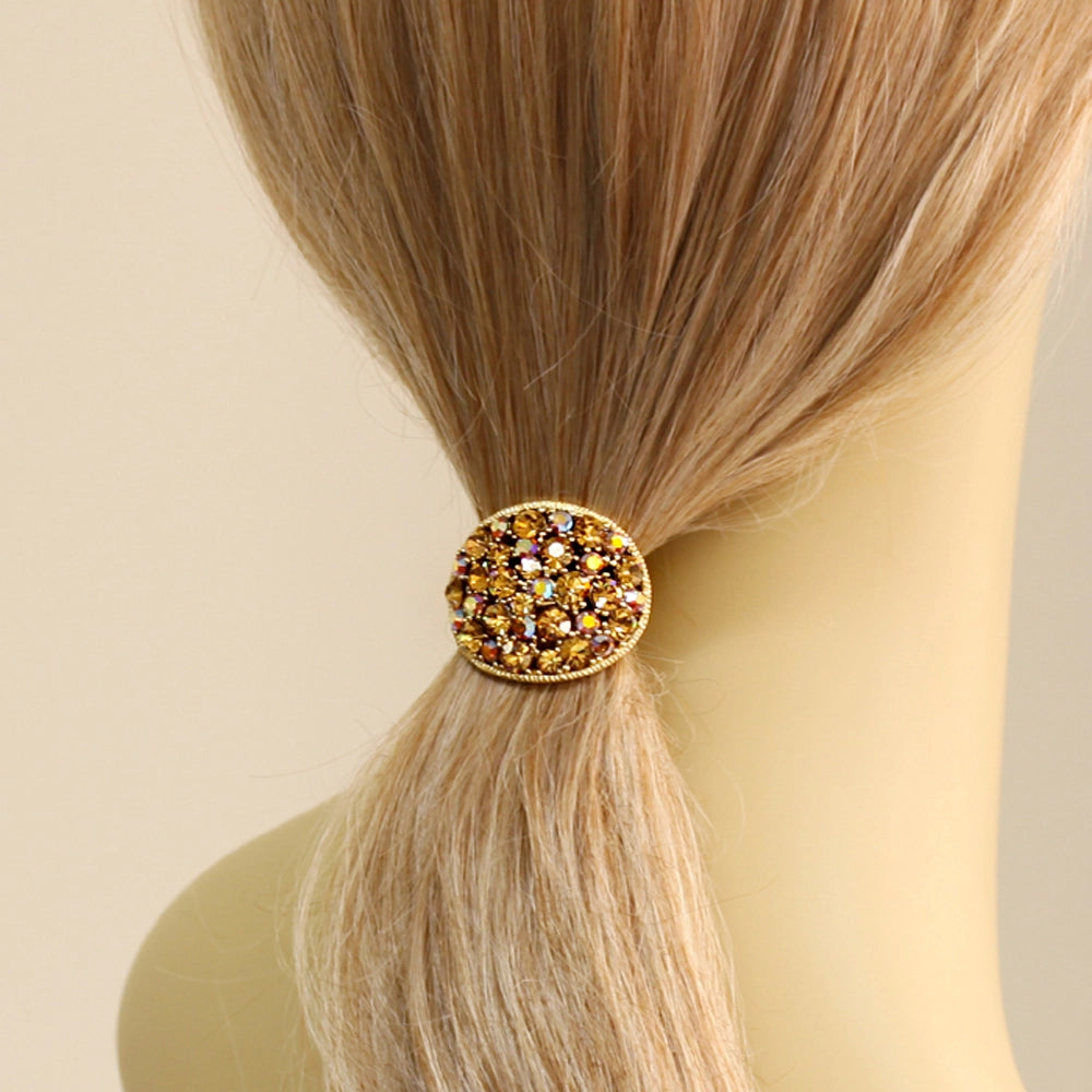 gold crystal ponytail holder in hair